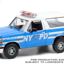 1992 Ford Bronco NYPD grabber blue with white stripes driver's side view