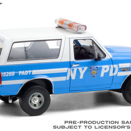 1992 Ford Bronco NYPD grabber blue with white stripes passenger side view